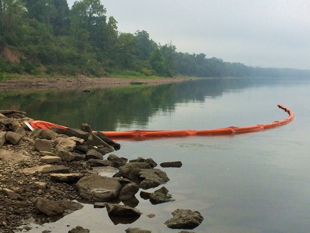 A containment boom is deployed on the Ohio River to deal with a fuel oil spill. (Photo by Dwayne Slavey) 